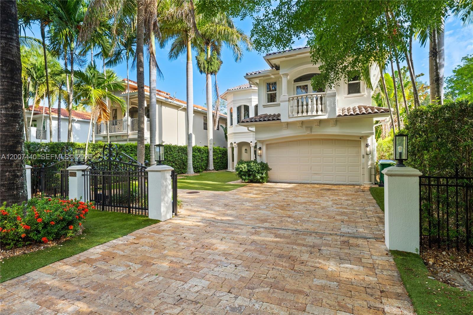 4065 Battersea Road Miami, FL 33133 - Photo 31 of 39 a front view of a house with a yard and palm trees