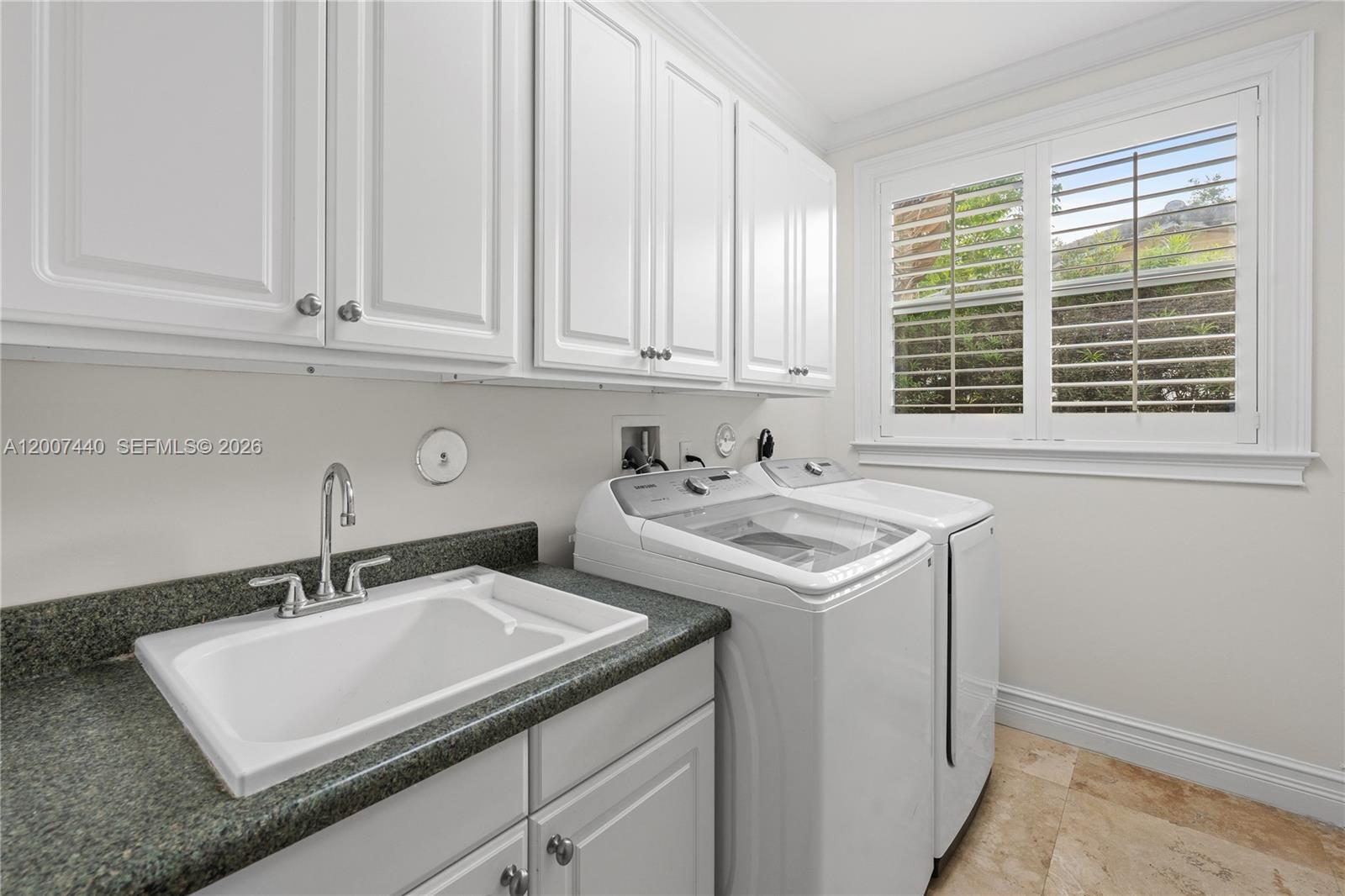 4065 Battersea Road Miami, FL 33133 - Photo 33 of 39 a utility room with dryer and washer