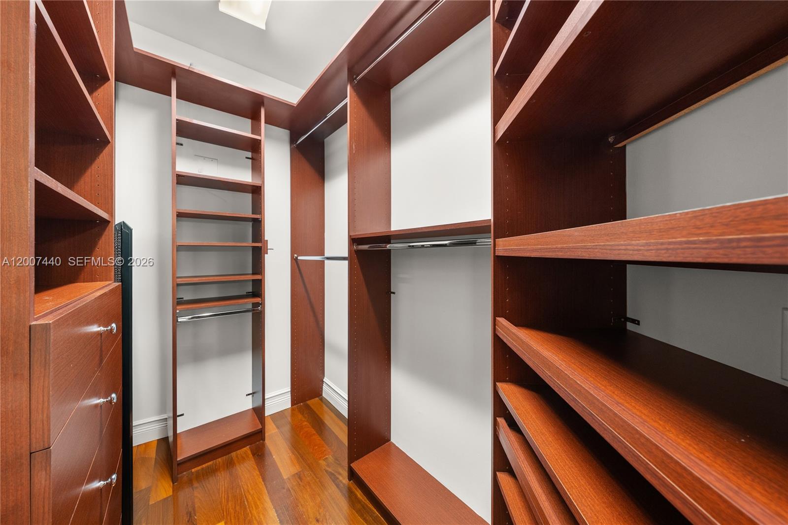 4065 Battersea Road Miami, FL 33133 - Photo 34 of 39 a view of walk in closet with empty racks