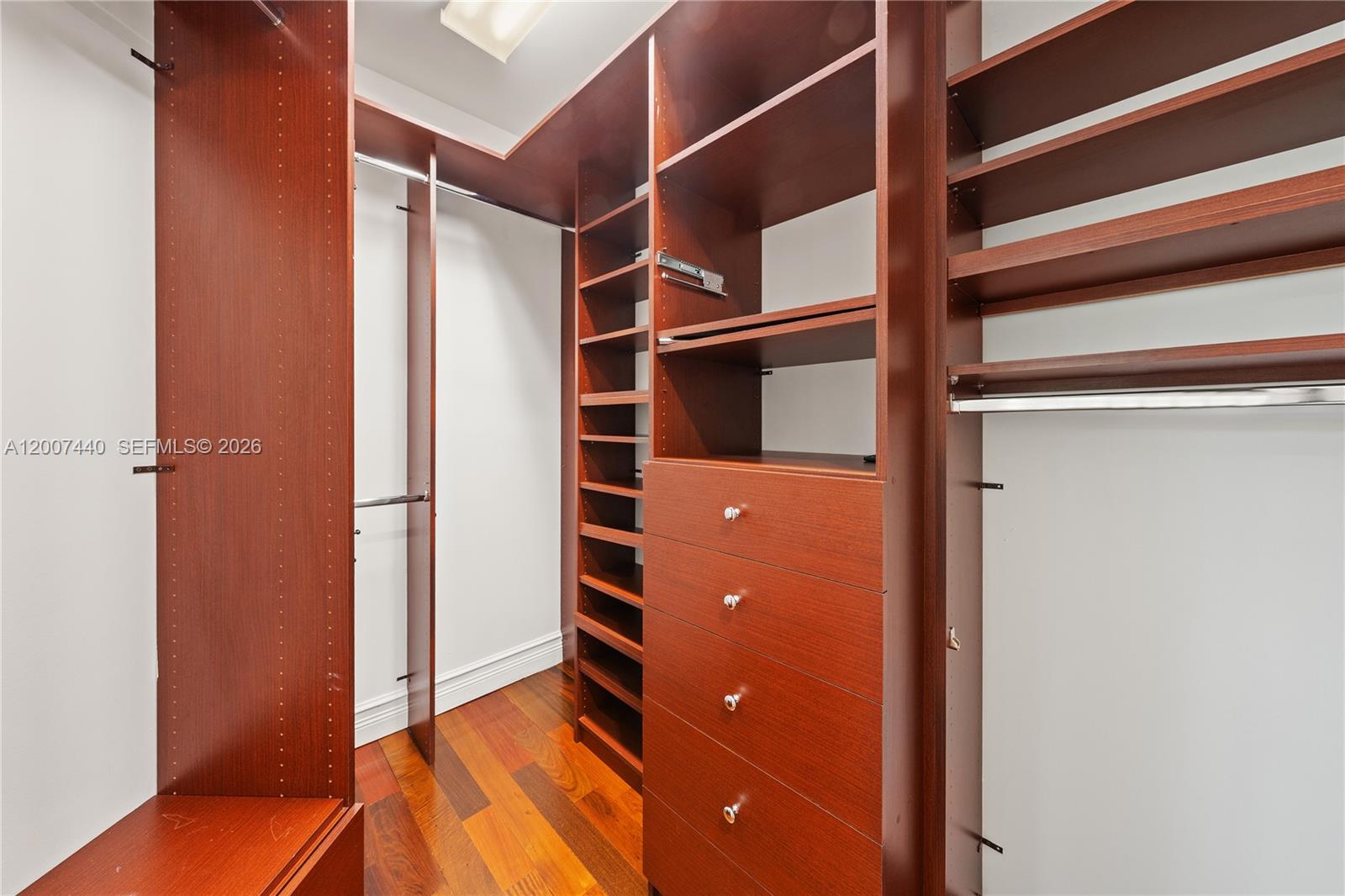 4065 Battersea Road Miami, FL 33133 - Photo 35 of 39 a view of walk in closet with empty racks