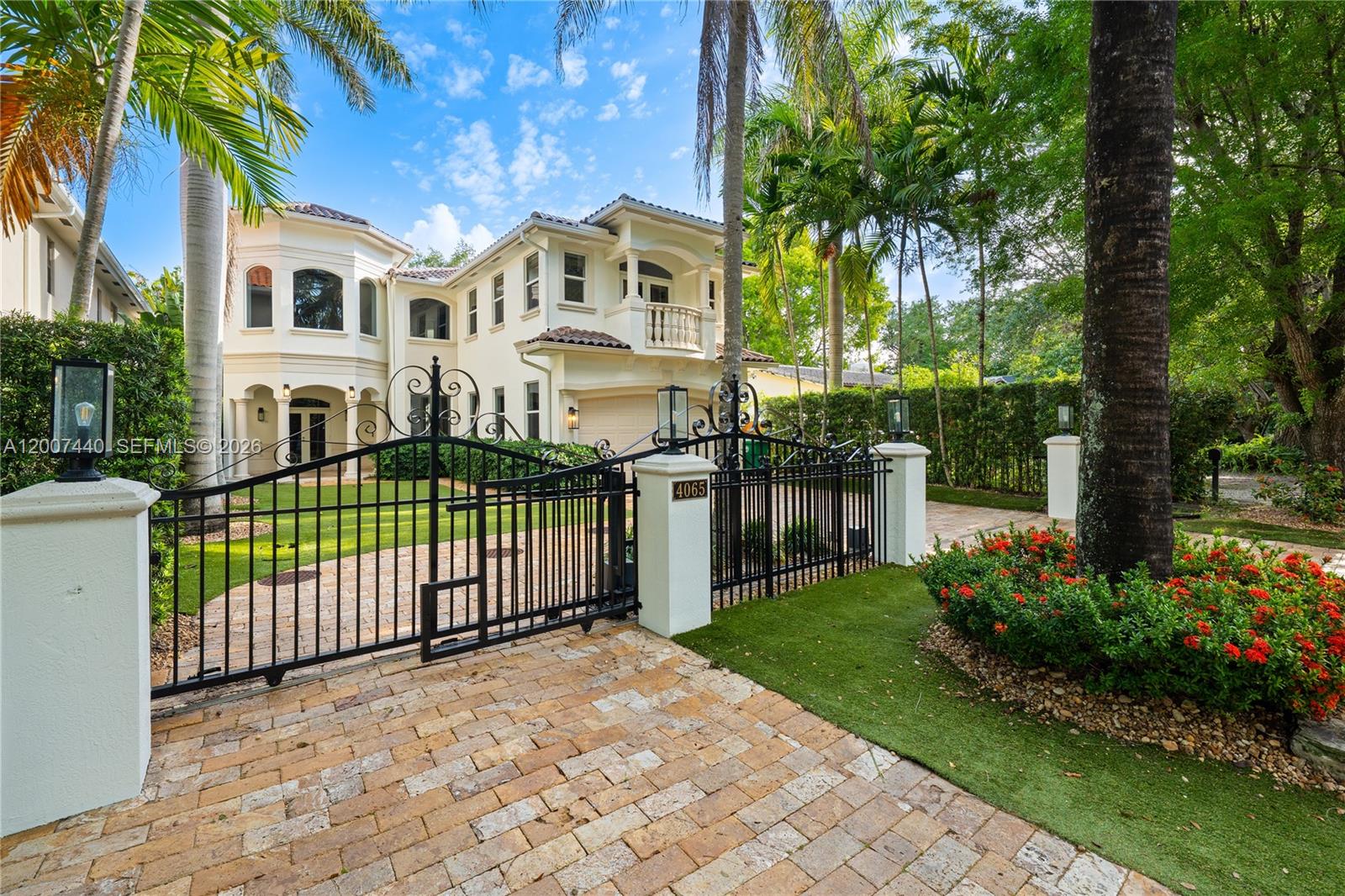 4065 Battersea Road Miami, FL 33133 - Photo 38 of 39 a front view of a house with a garden