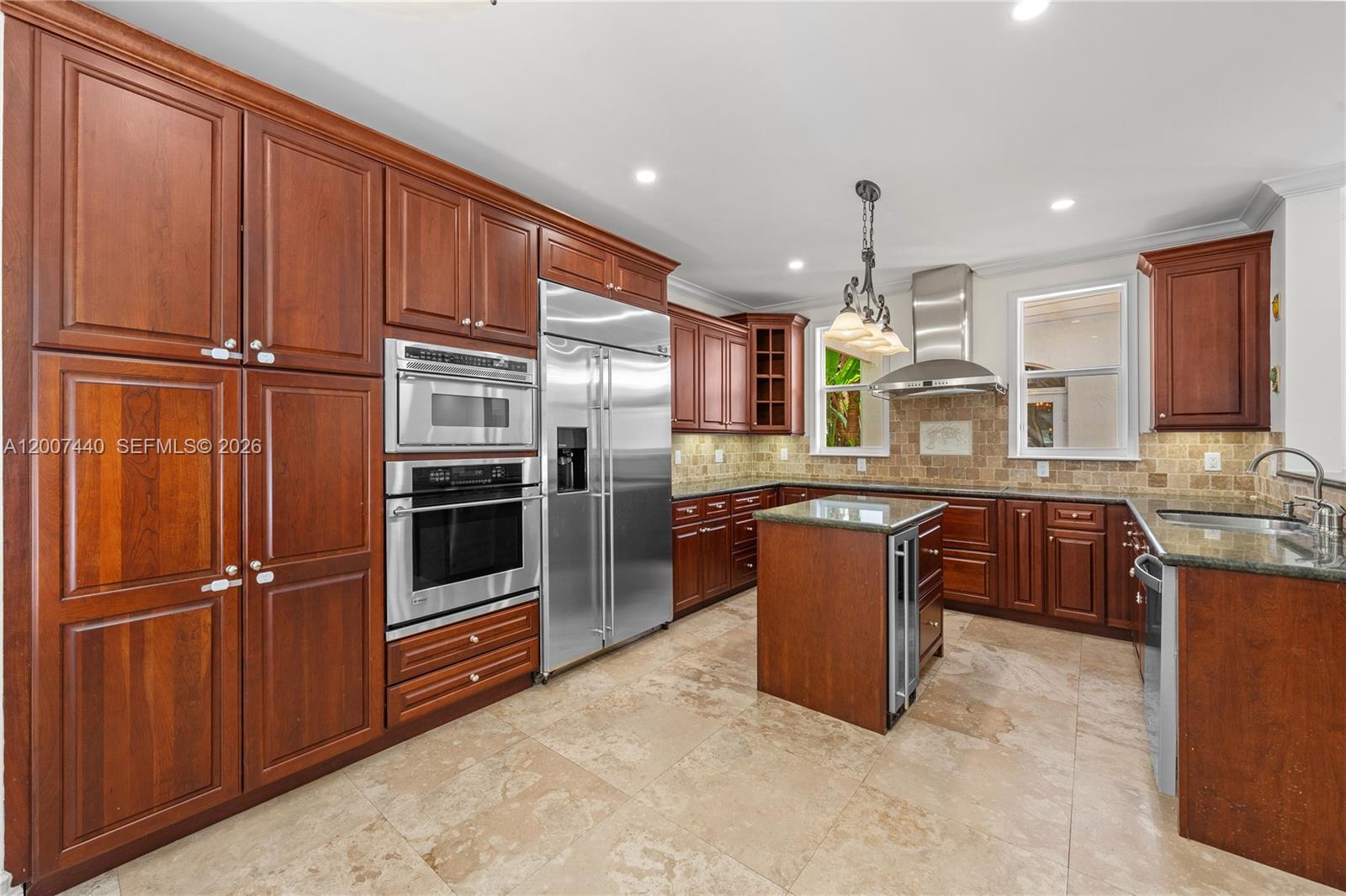 4065 Battersea Road Miami, FL 33133 - Photo 8 of 39 a kitchen with stainless steel appliances granite countertop a refrigerator a stove a sink and a microwave