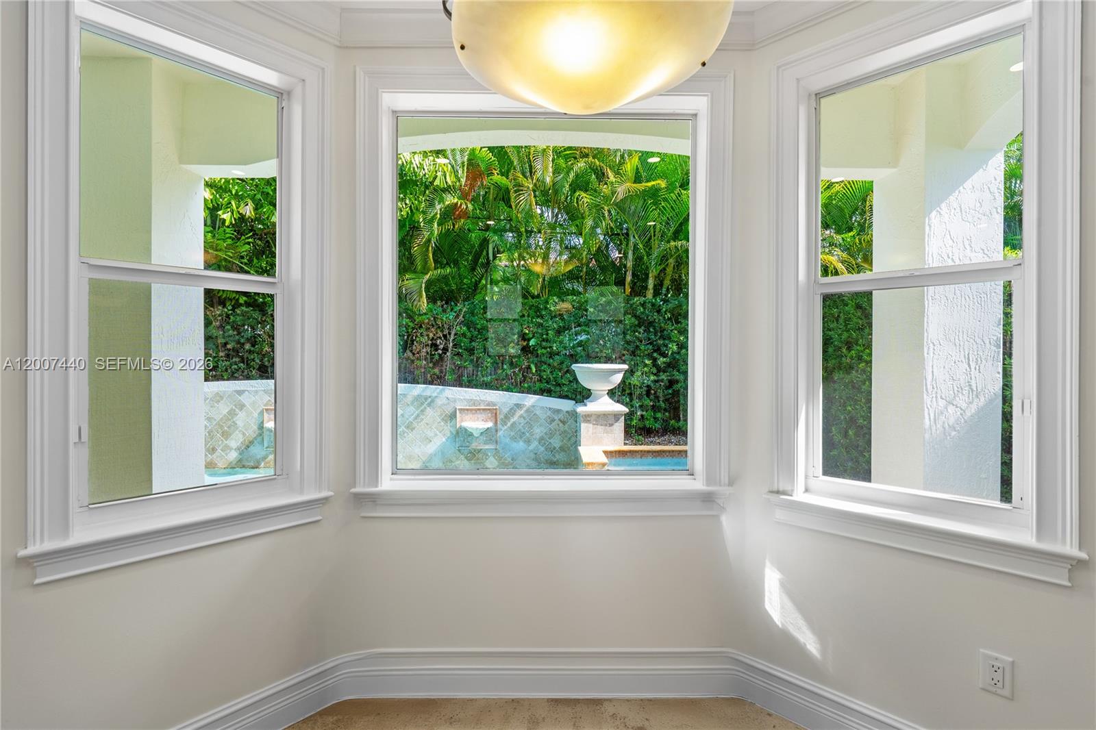 4065 Battersea Road Miami, FL 33133 - Photo 10 of 39 a view of a room that has a window and a ceiling fan