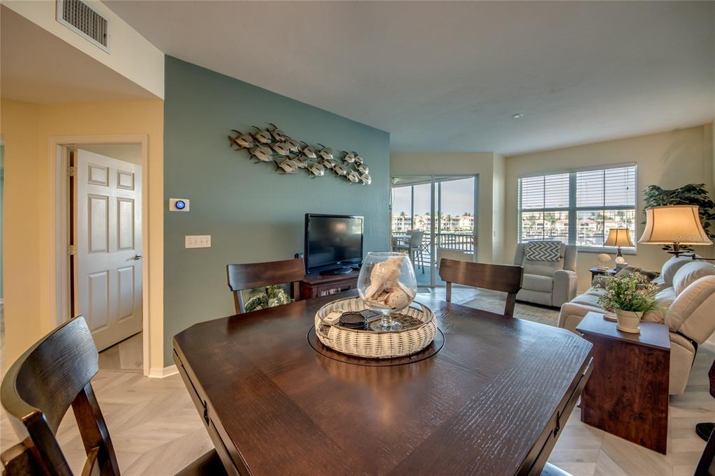2090 Matecumbe Key Road, Unit 1202 Punta Gorda, FL 33955 - Photo 11 of 42 a living room with furniture and a table