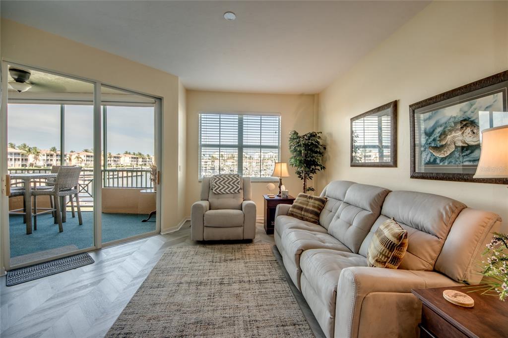 2090 Matecumbe Key Road, Unit 1202 Punta Gorda, FL 33955 - Photo 13 of 42 a living room with furniture and a large window