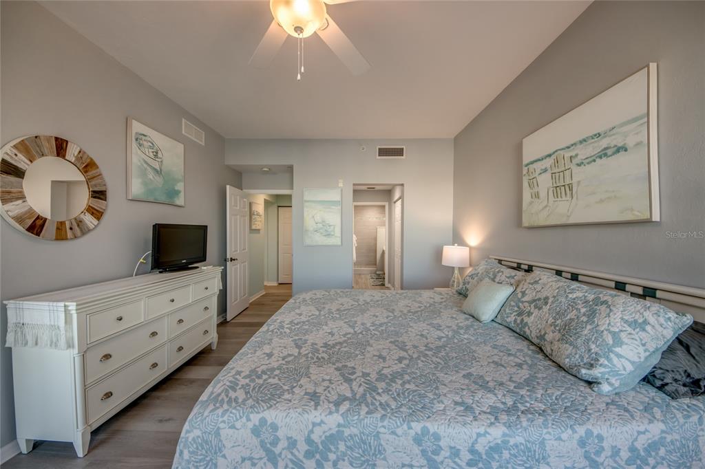 2090 Matecumbe Key Road, Unit 1202 Punta Gorda, FL 33955 - Photo 19 of 42 a spacious bedroom with a bed and a television