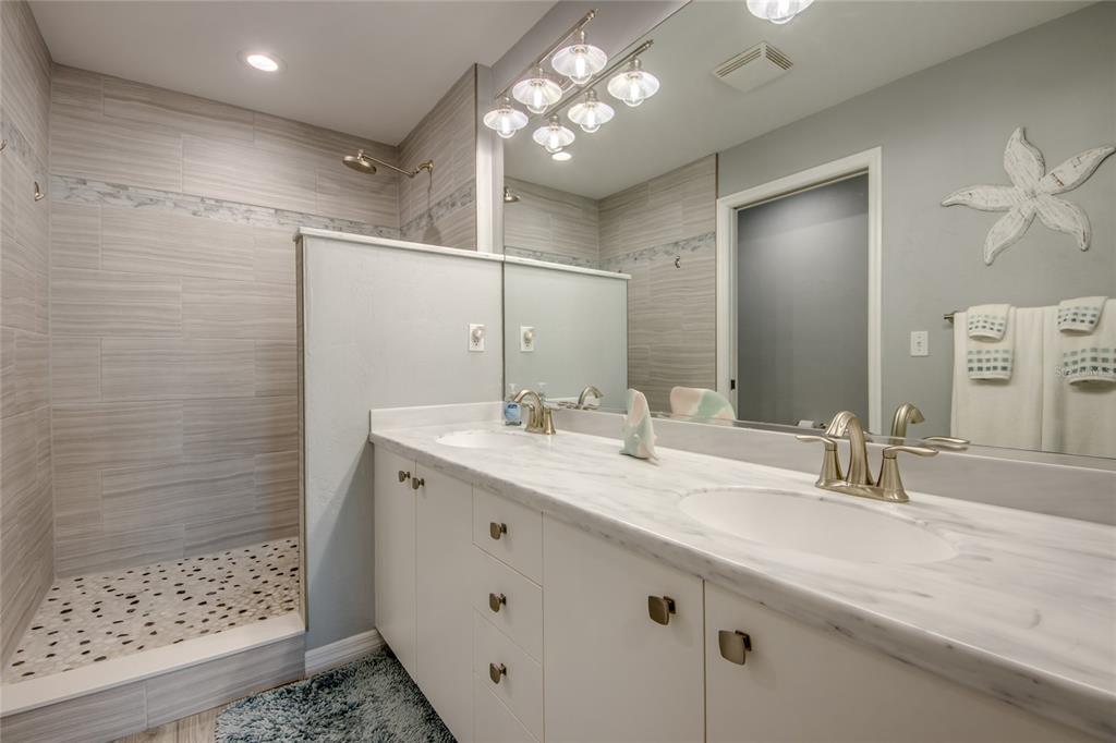 2090 Matecumbe Key Road, Unit 1202 Punta Gorda, FL 33955 - Photo 21 of 42 a bathroom with a sink and a mirror