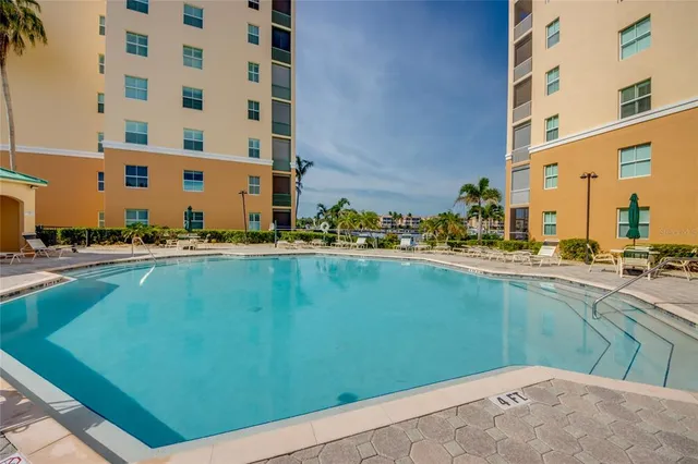 a view of a swimming pool with a patio