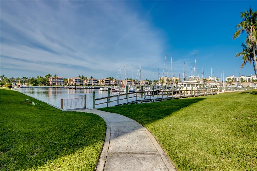 2090 Matecumbe Key Road, Unit 1202 Punta Gorda, FL 33955 - Photo 35 of 42 a view of a garden with lawn chairs