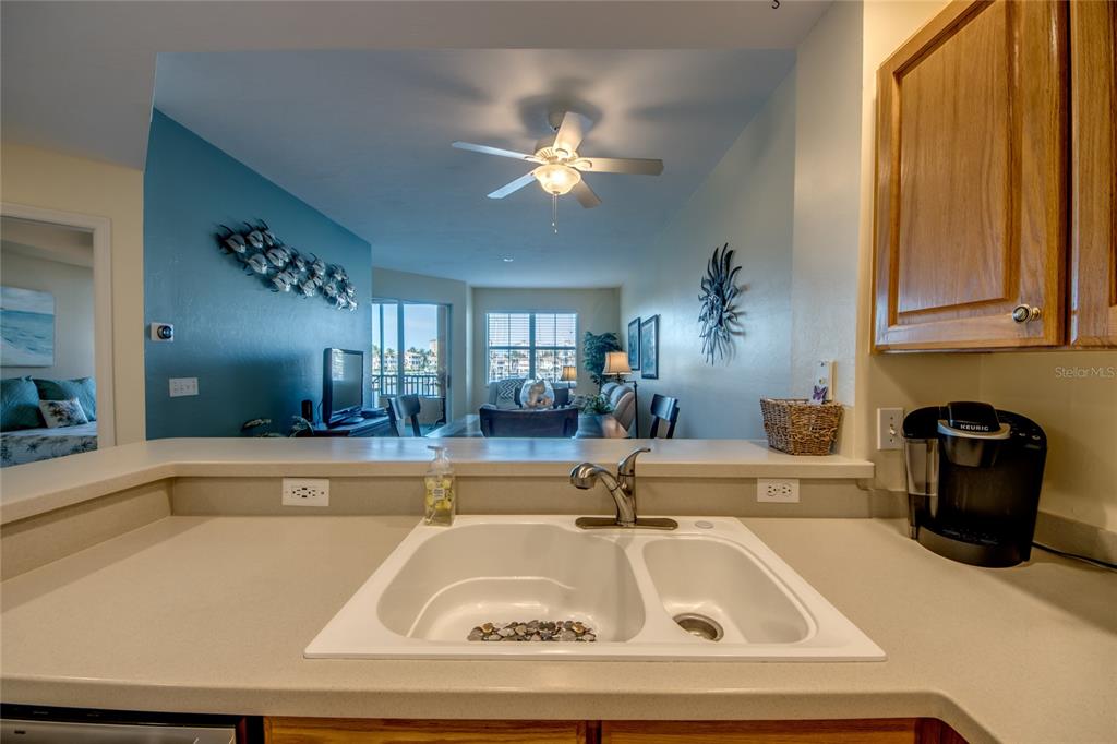 2090 Matecumbe Key Road, Unit 1202 Punta Gorda, FL 33955 - Photo 6 of 42 a kitchen with a sink and chandelier