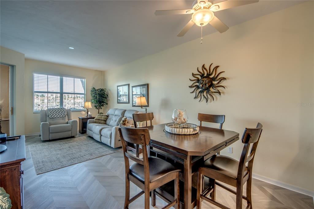 2090 Matecumbe Key Road, Unit 1202 Punta Gorda, FL 33955 - Photo 9 of 42 a view of a dining room with furniture and a potted plant