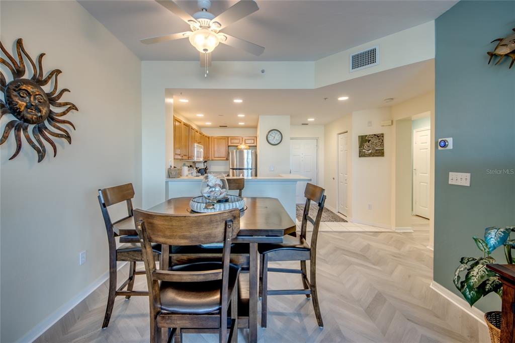 2090 Matecumbe Key Road, Unit 1202 Punta Gorda, FL 33955 - Photo 10 of 42 a view of a dining room with furniture and chandelier