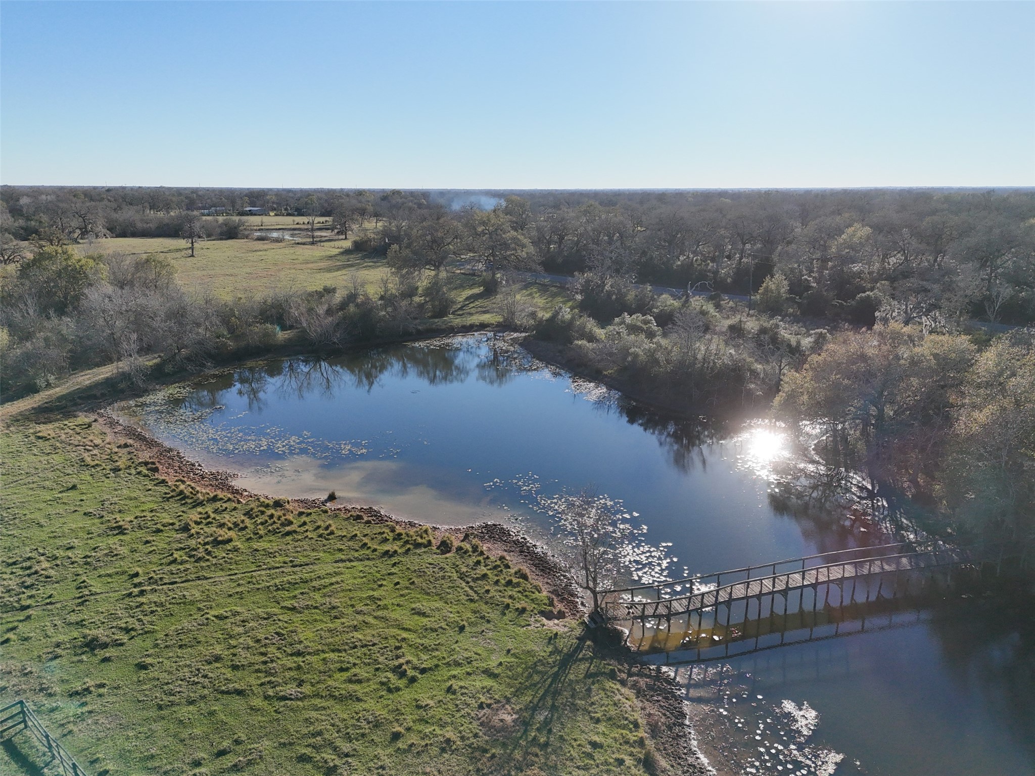 0 Jozwiack Prairie View Prairie View, TX 77445 - Photo 6 of 8 a view of a lake in middle of forest