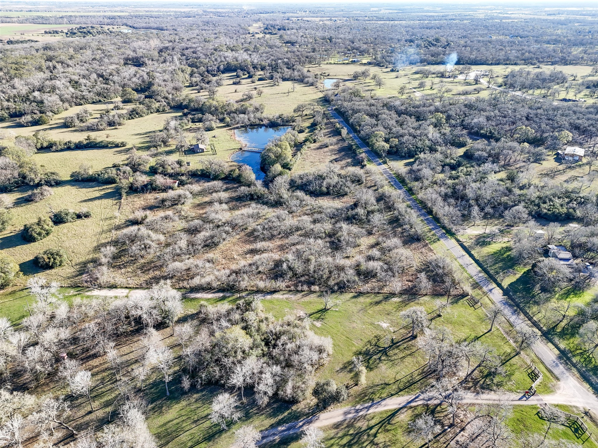 0 Jozwiack Prairie View Prairie View, TX 77445 - Photo 7 of 8 an aerial view of residential houses with outdoor space and trees