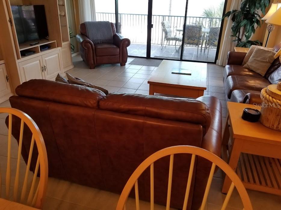 13650 Gulf Boulevard, Unit 304 Madeira Beach, FL 33708 - Photo 25 of 63 a livingroom with furniture wooden floor and windows