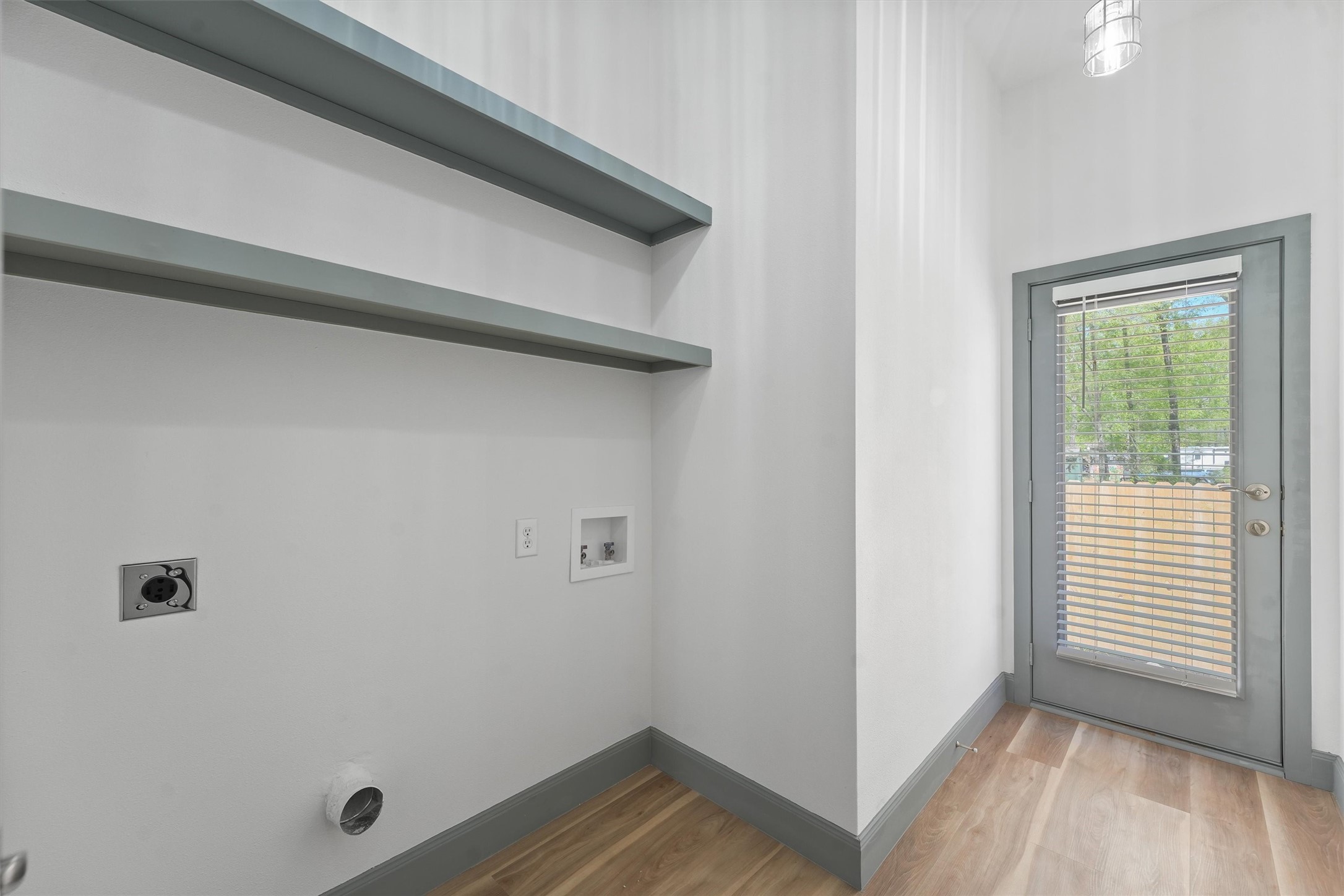 200 Canary Street Point Blank, TX 77364 - Photo 13 of 25 a view of a hallway with wooden floor and a window