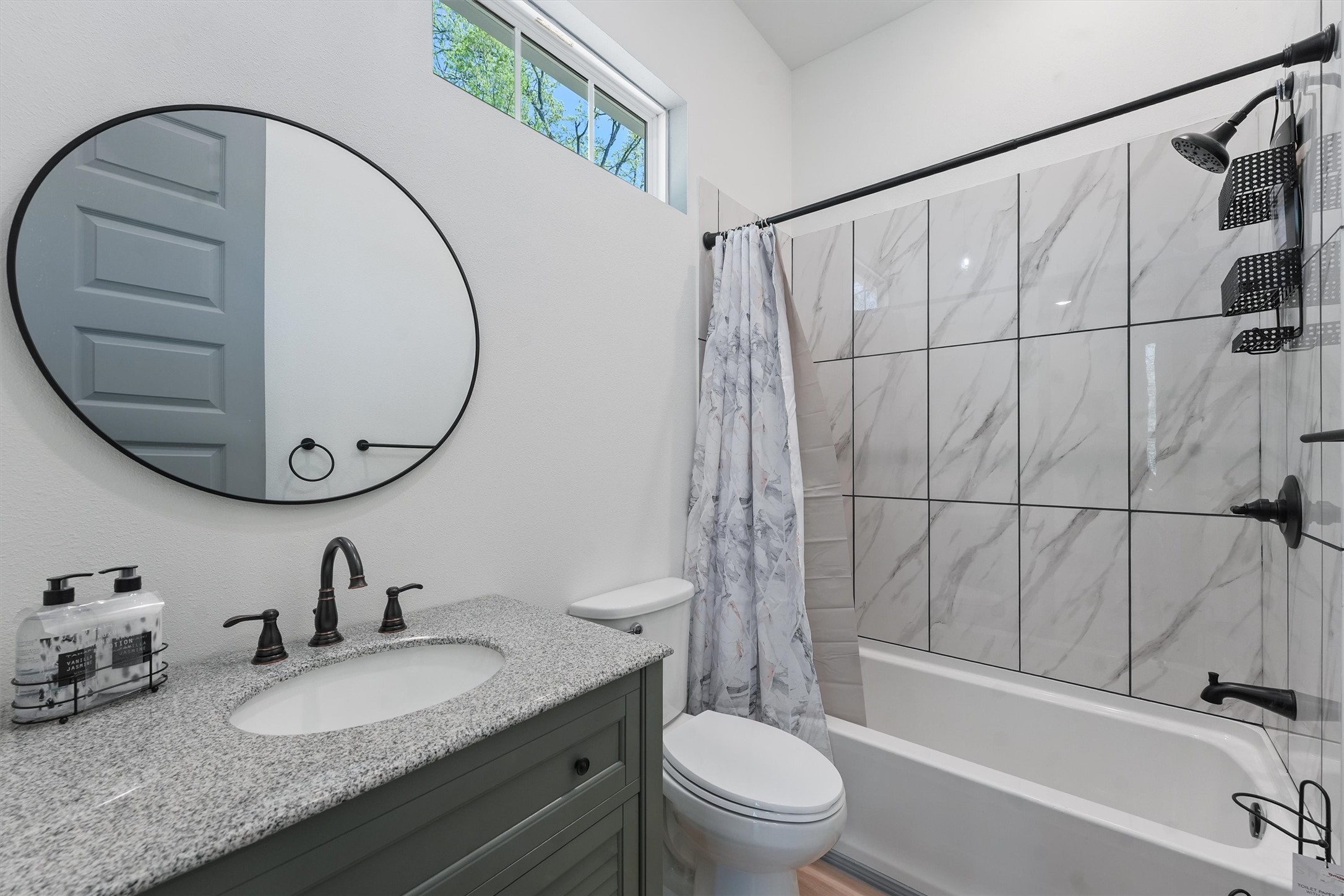 200 Canary Street Point Blank, TX 77364 - Photo 18 of 25 a bathroom with a granite countertop sink a toilet and a mirror