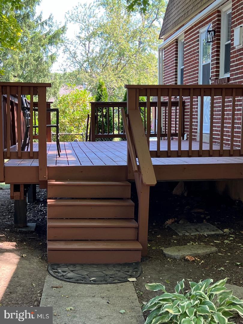 237 Miner Street Malvern, PA 19355 - Photo 28 of 28 a view of a deck with a bench next to a yard