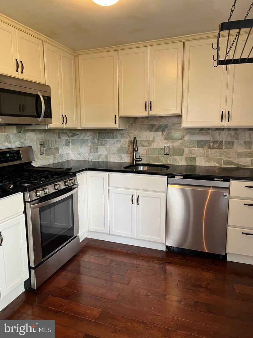 237 Miner Street Malvern, PA 19355 - Photo 10 of 28 a white kitchen with granite countertop stainless steel appliances