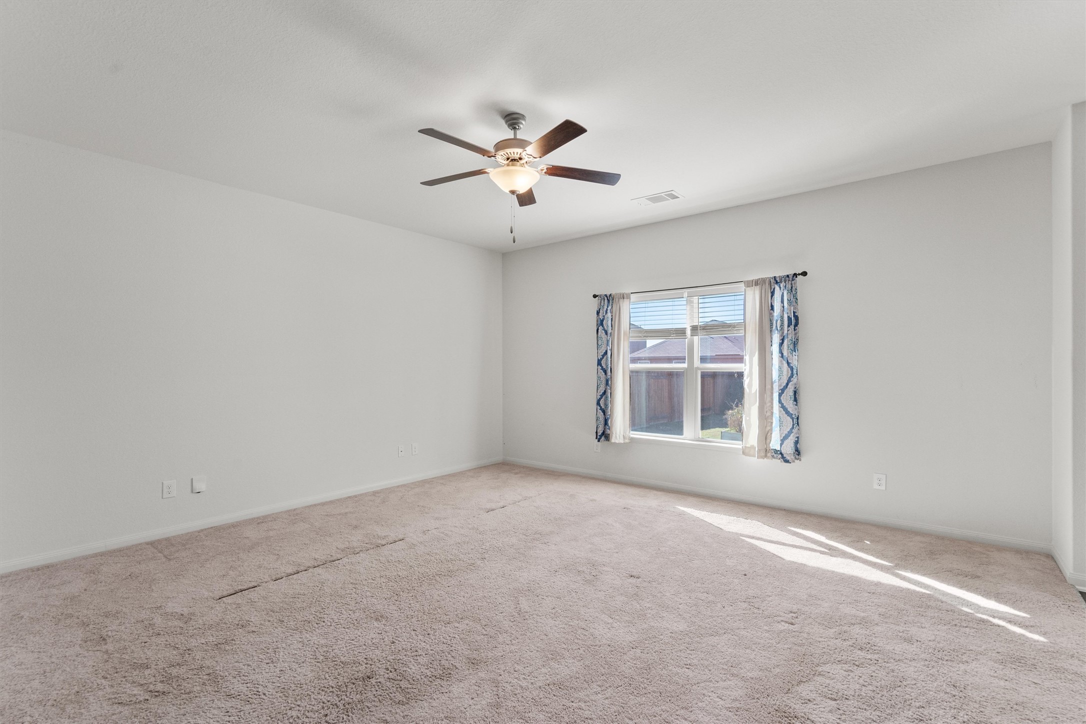 14405 Boomtown Way Elgin, TX 78621 - Photo 11 of 39 a view of an empty room with a window