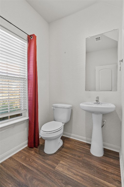 14405 Boomtown Way Elgin, TX 78621 - Photo 12 of 39 a bathroom with a sink toilet and a mirror