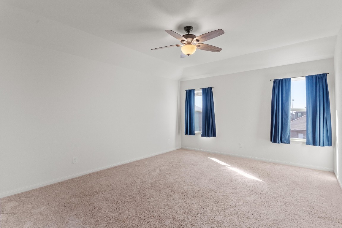 14405 Boomtown Way Elgin, TX 78621 - Photo 14 of 39 a view of an empty room with chandelier fan