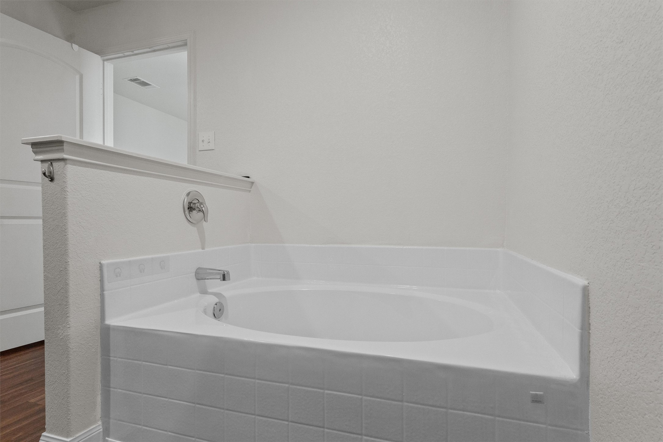 14405 Boomtown Way Elgin, TX 78621 - Photo 17 of 39 a close up of a bathtub in a bathroom