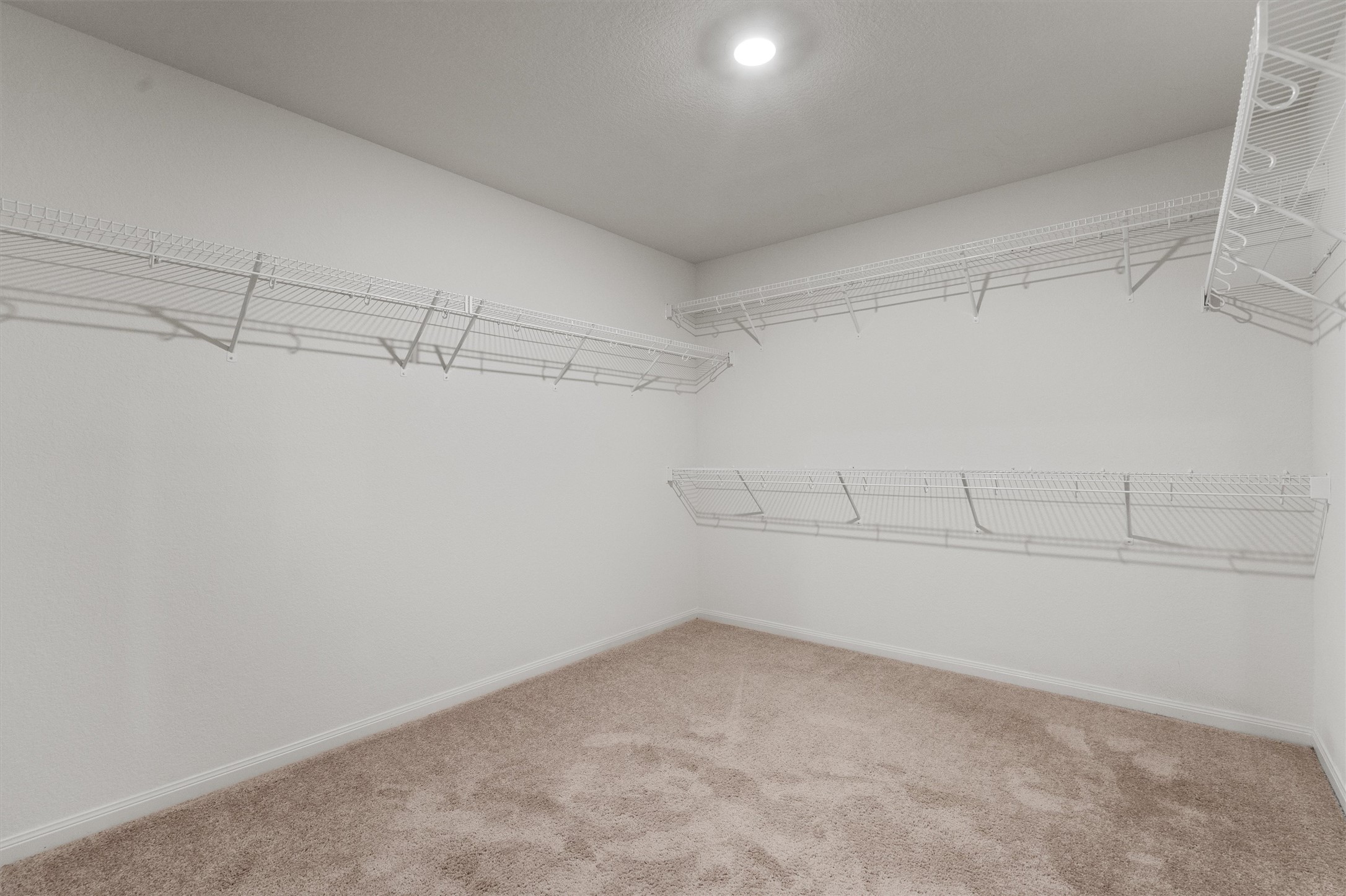 14405 Boomtown Way Elgin, TX 78621 - Photo 19 of 39 a view of a room with racks on the wall