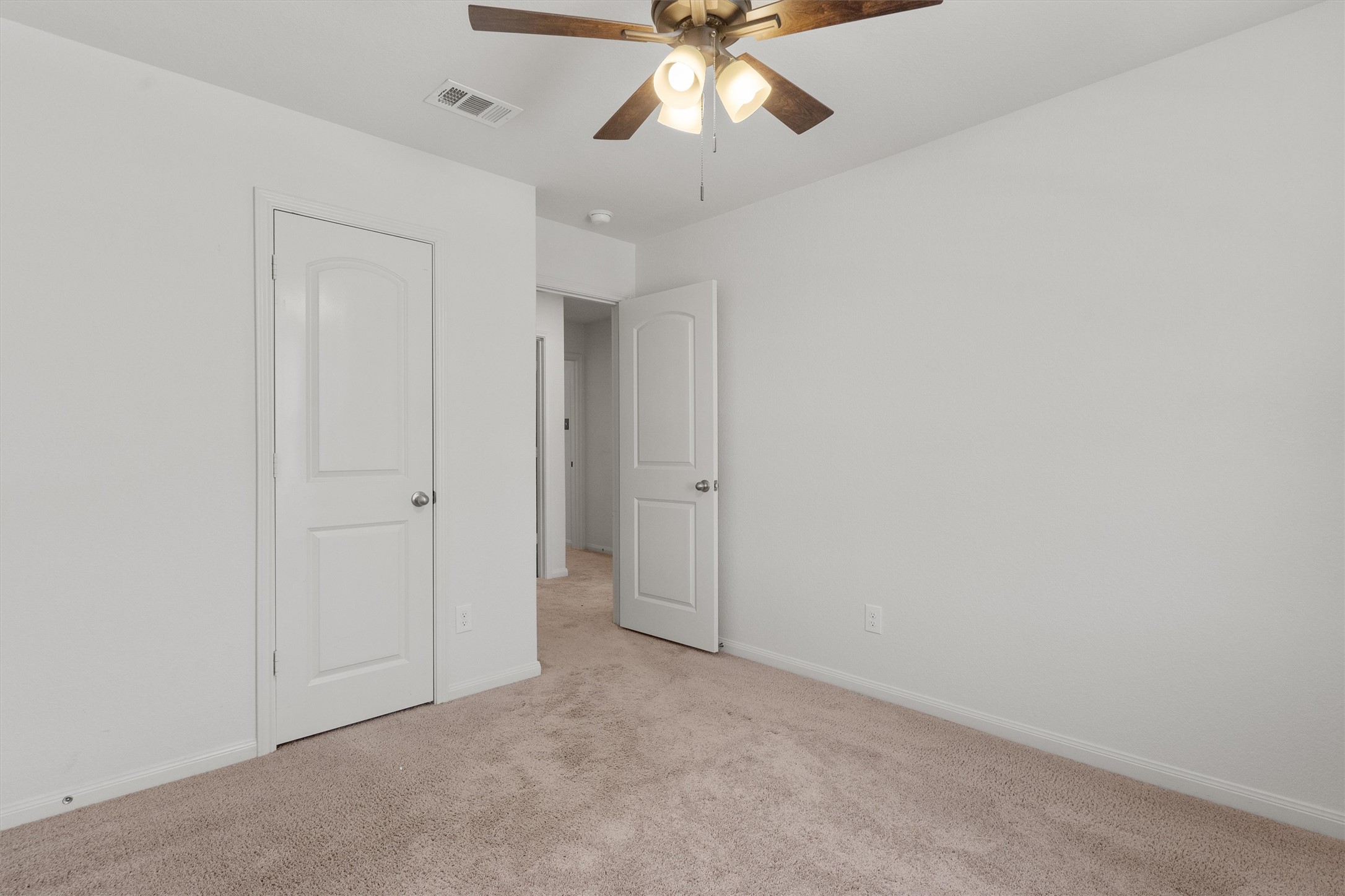 14405 Boomtown Way Elgin, TX 78621 - Photo 22 of 39 a view of an empty room and chandelier fan