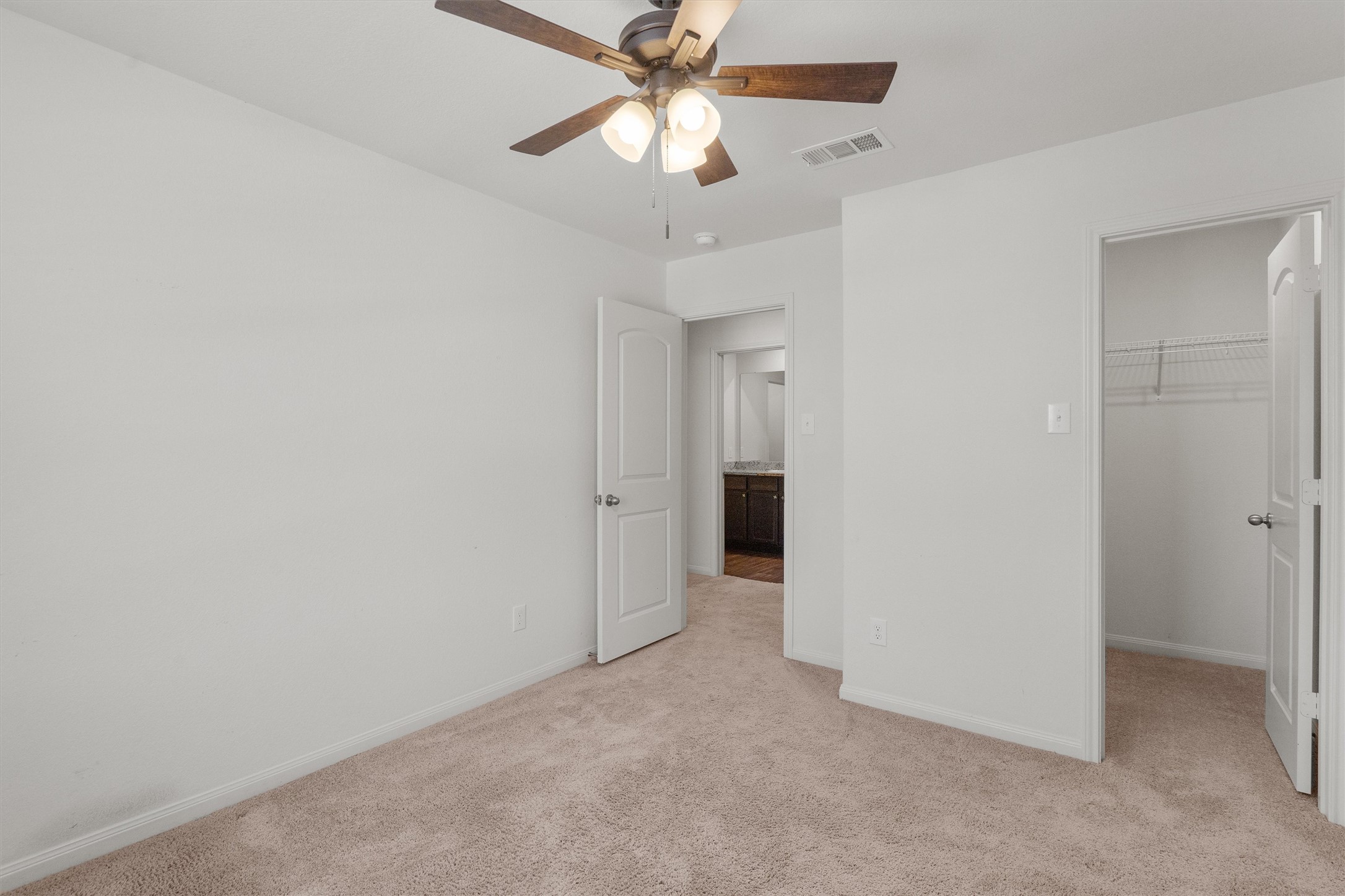 14405 Boomtown Way Elgin, TX 78621 - Photo 24 of 39 a view of an empty room and chandelier fan