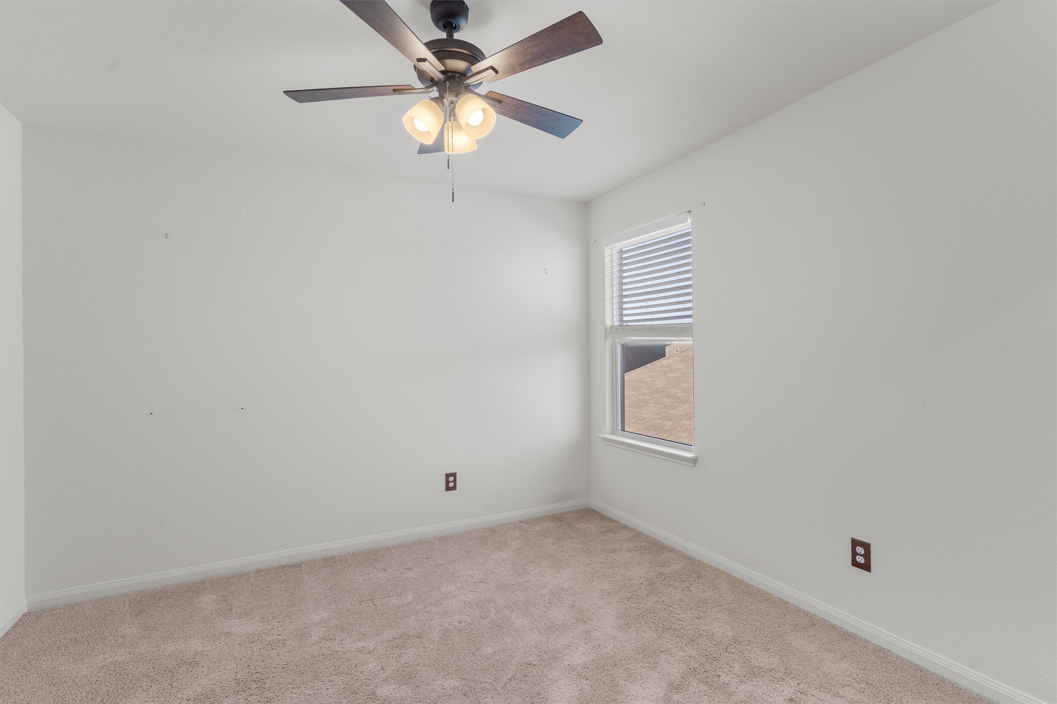 14405 Boomtown Way Elgin, TX 78621 - Photo 25 of 39 an empty room with windows and fan