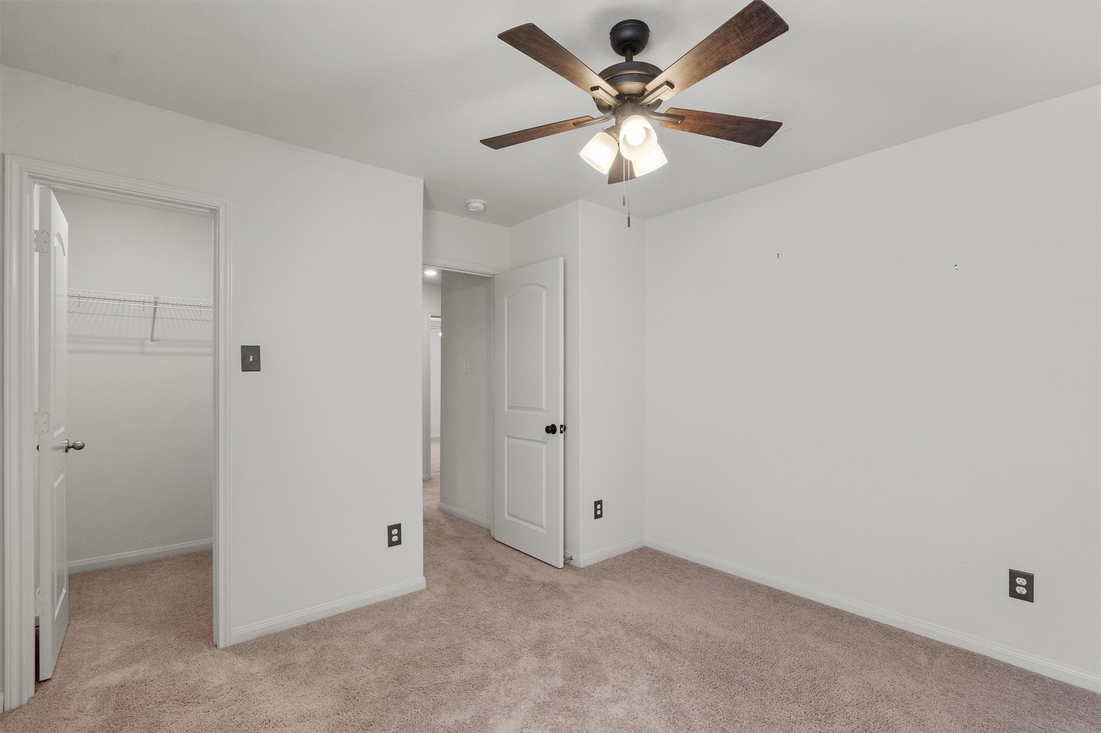 14405 Boomtown Way Elgin, TX 78621 - Photo 26 of 39 an empty room with a fan & a ceiling fan