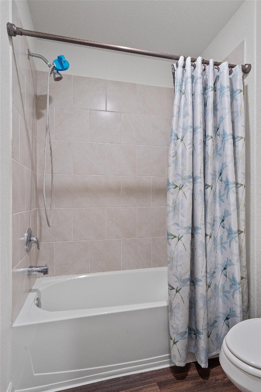 14405 Boomtown Way Elgin, TX 78621 - Photo 28 of 39 a bathroom with a shower curtain and a bathtub