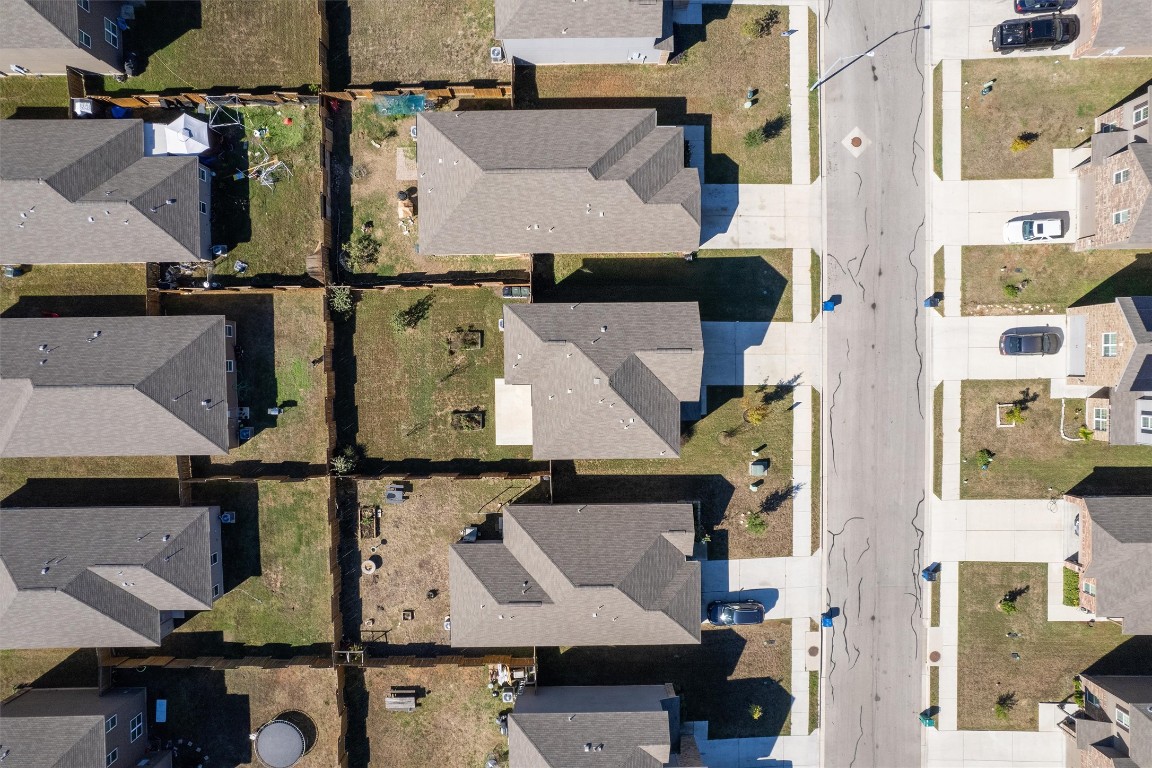 14405 Boomtown Way Elgin, TX 78621 - Photo 34 of 39 an aerial view of residential houses with outdoor space