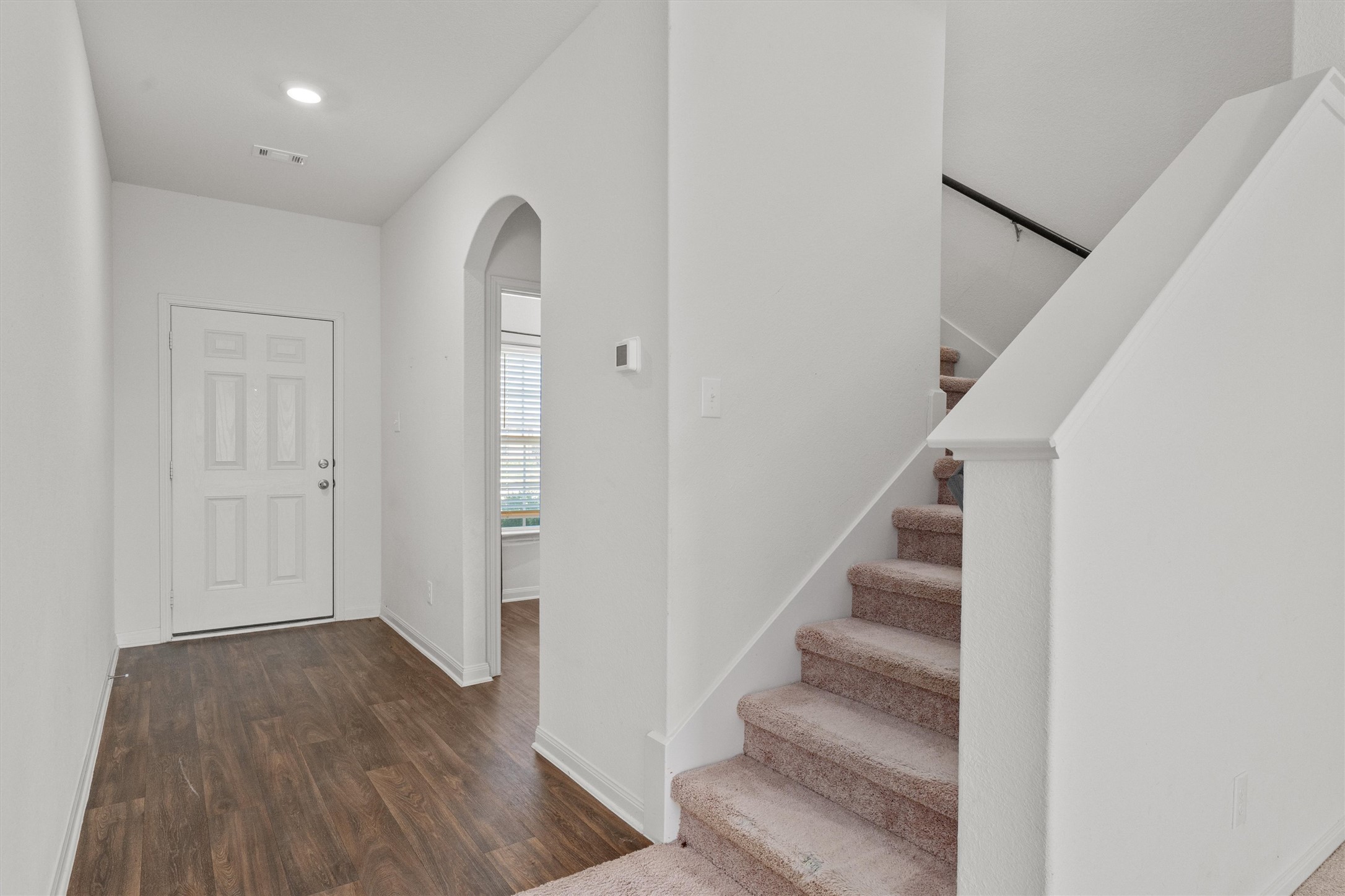 14405 Boomtown Way Elgin, TX 78621 - Photo 9 of 39 a view of entryway with wooden floor