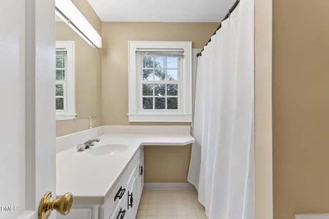 a bed room with a bed and a flat screen tv