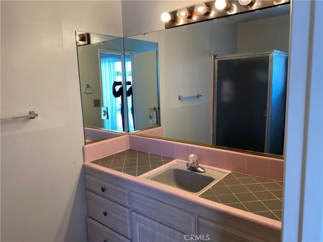 a bathroom with a sink and a mirror