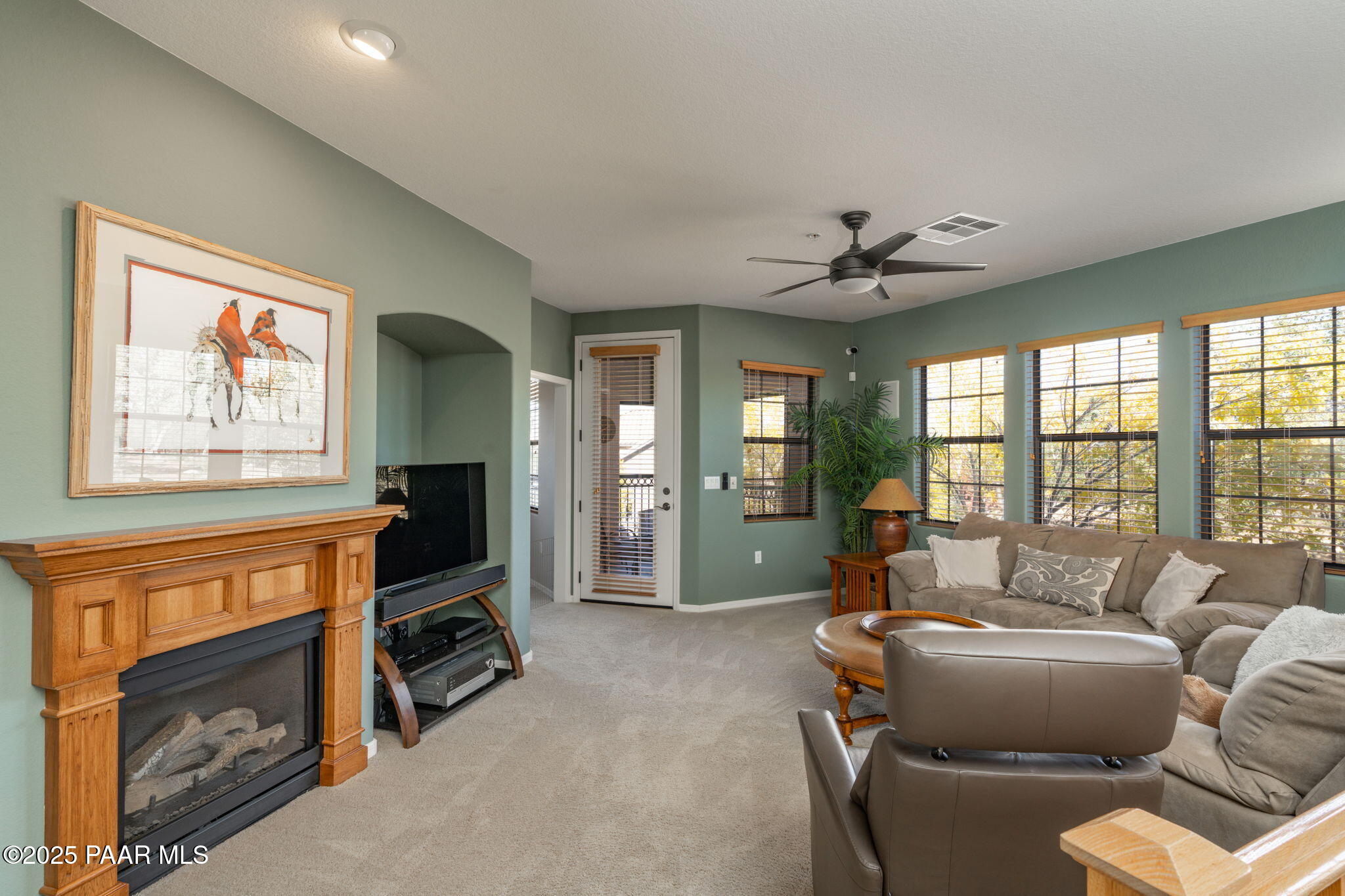 1716 Alpine Meadows Lane, Unit 305 Prescott, AZ 86303 - Photo 15 of 49 a living room with furniture and a fireplace