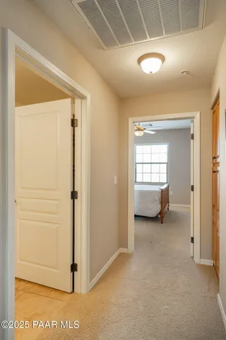 a view of a room that has a bed in it