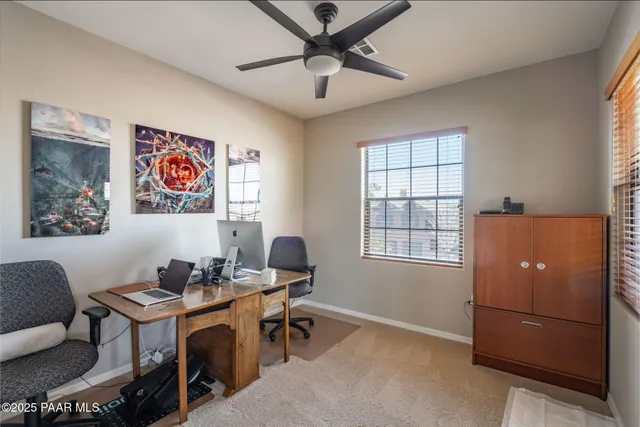 a workspace with furniture and window