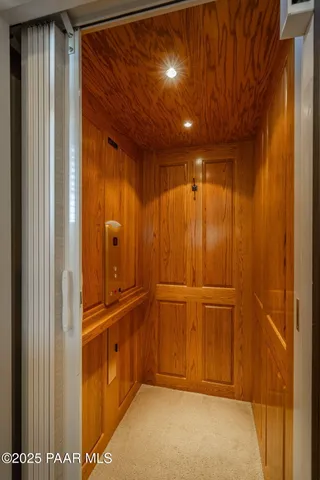 a view of entryway with wooden walls