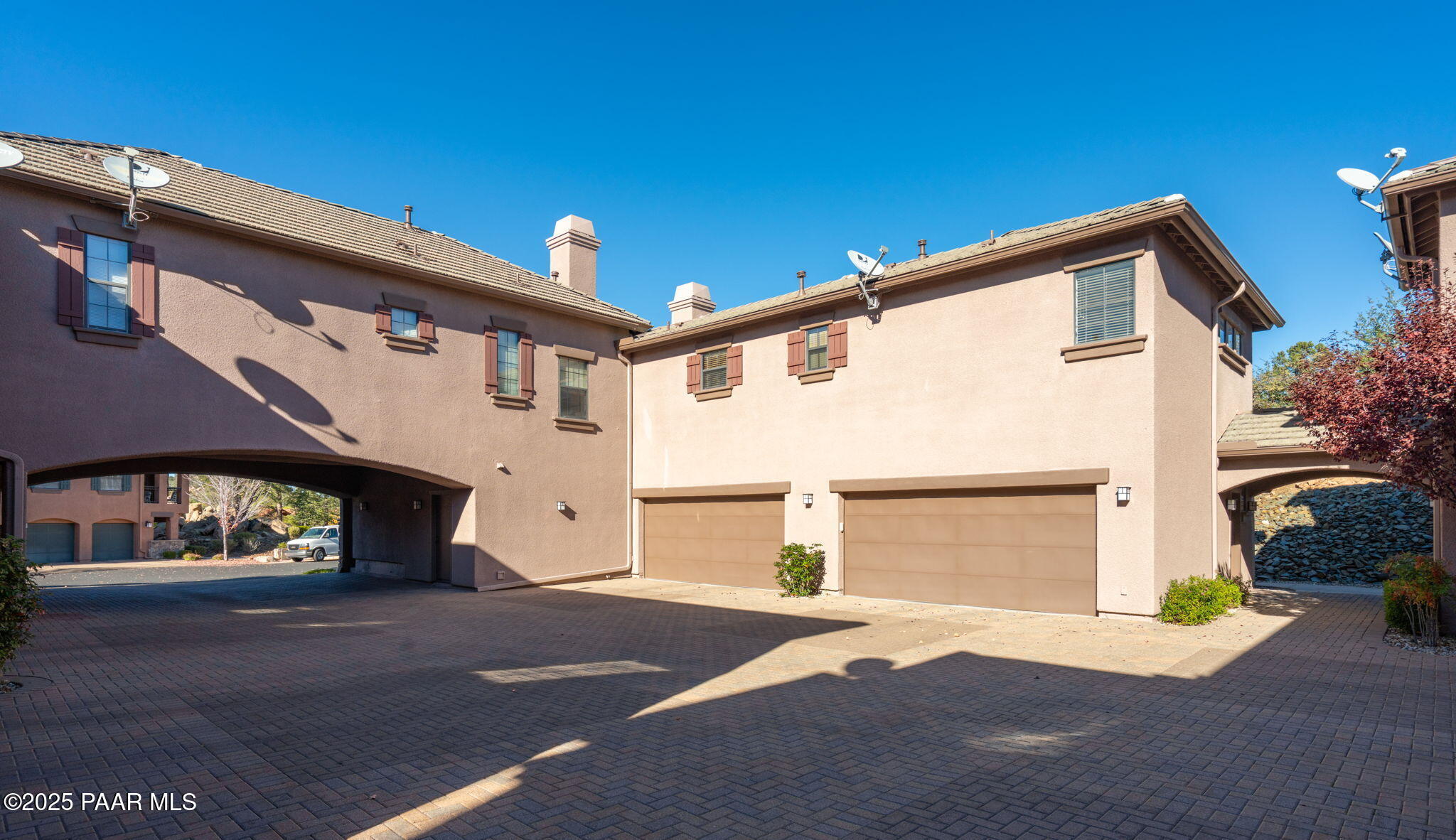 1716 Alpine Meadows Lane, Unit 305 Prescott, AZ 86303 - Photo 35 of 49 a front view of a house with a yard and garage