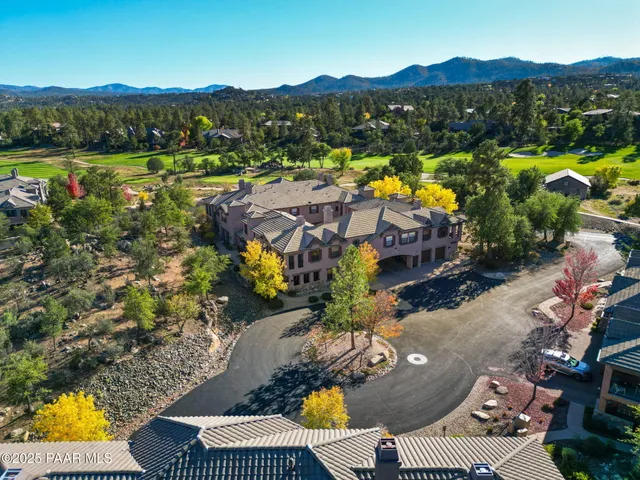 an aerial view of a house with a garden