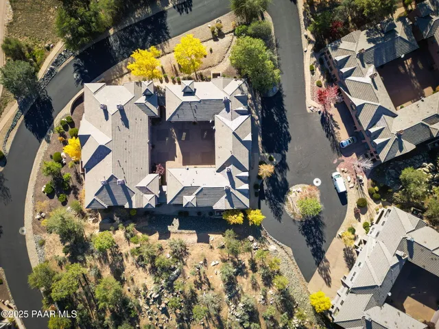 an aerial view of residential house and green space