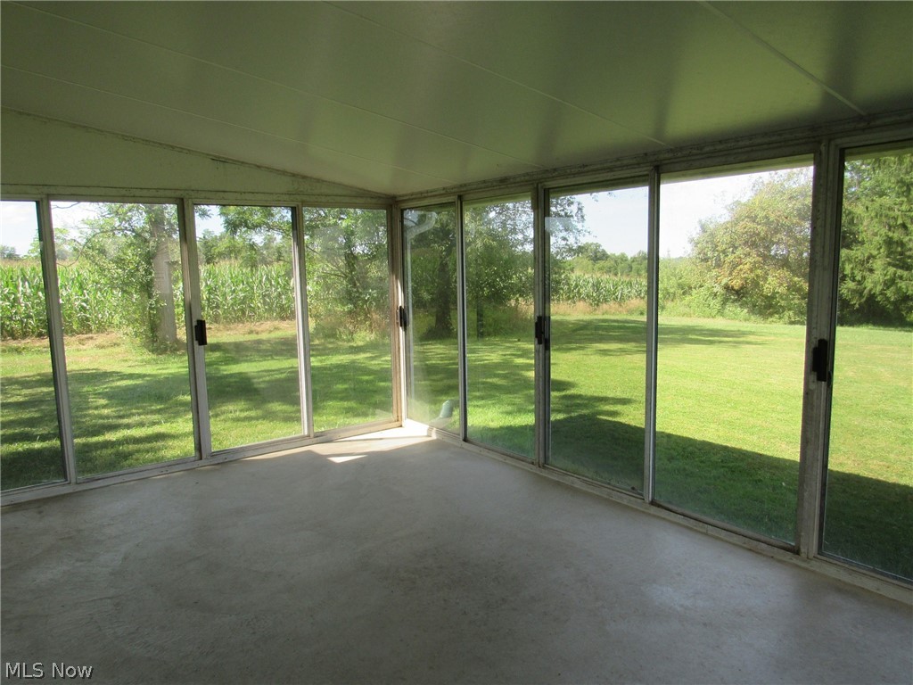 7263 Ross Road Madison, OH 44057 - Photo 12 of 24 Looking toward the Northwest corner of the property from enclosed patio.