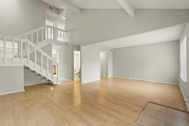 a view of an entryway with wooden floor