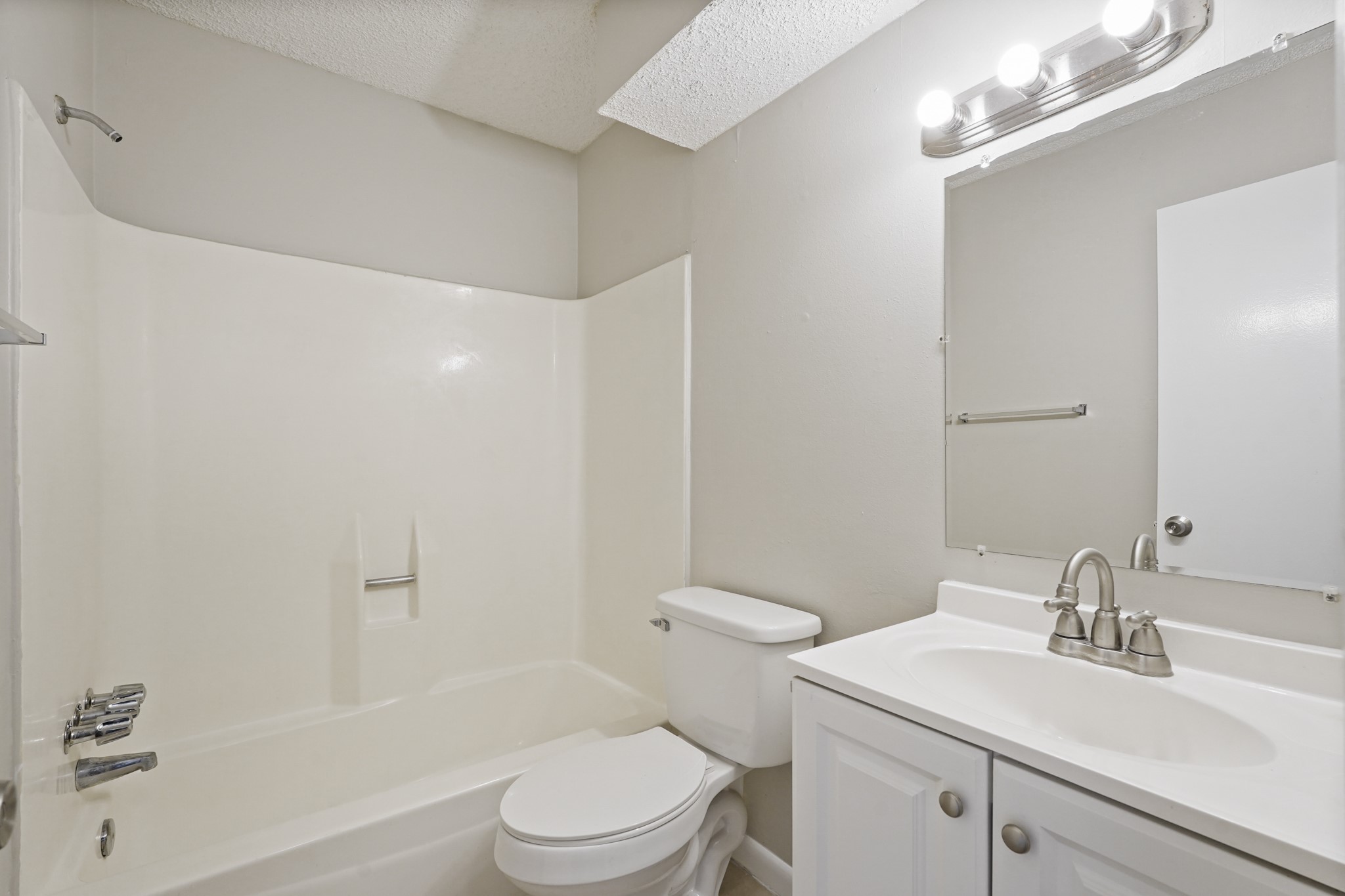 10328 Cook Road Houston, TX 77099 - Photo 8 of 16 a bathroom with a sink a toilet and shower