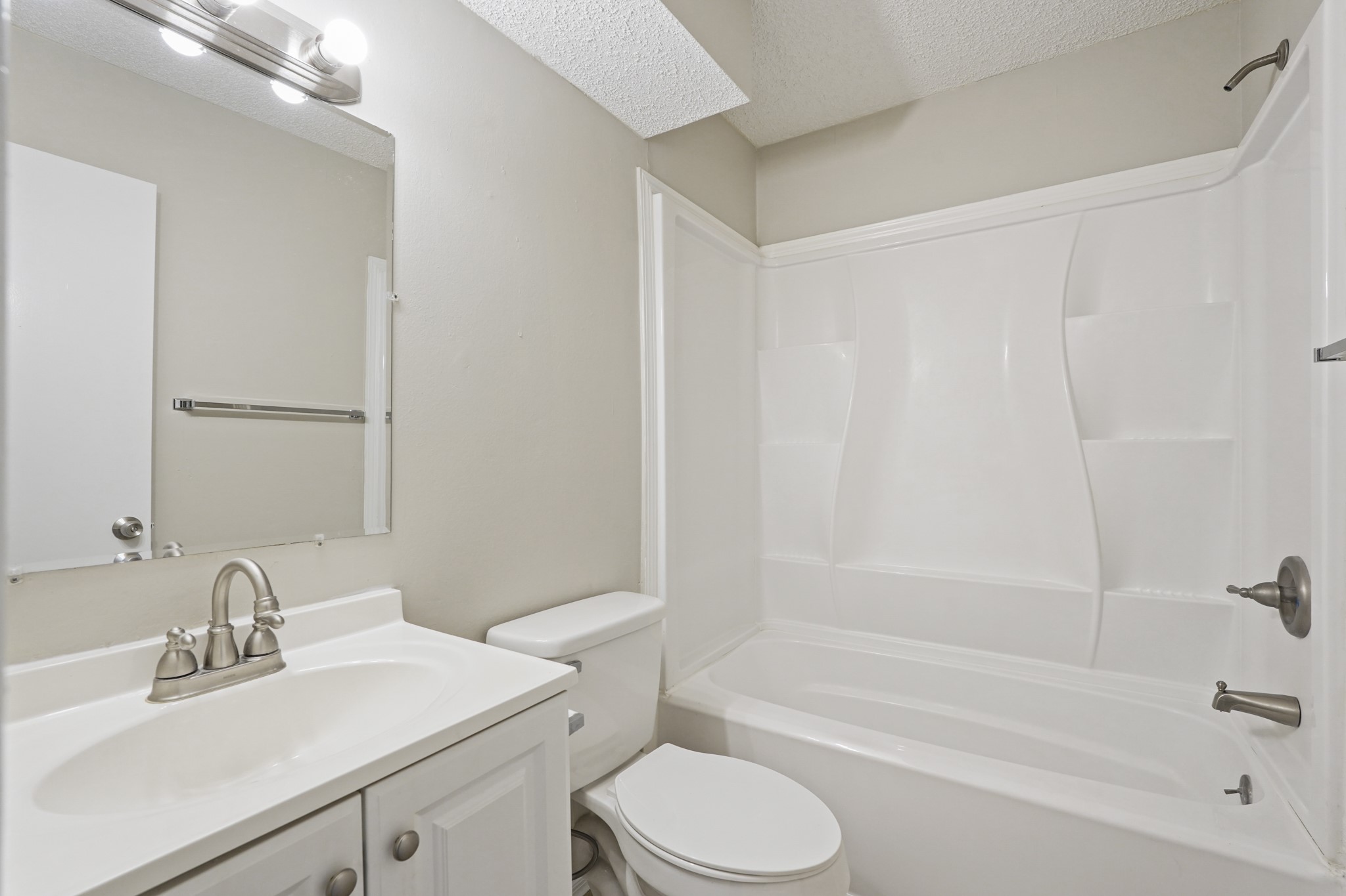 10328 Cook Road Houston, TX 77099 - Photo 9 of 16 a bathroom with a sink toilet and shower