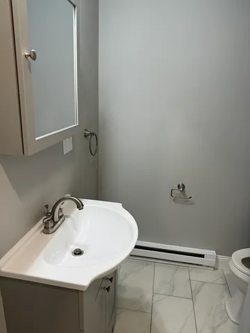a bathroom with a sink and a toilet