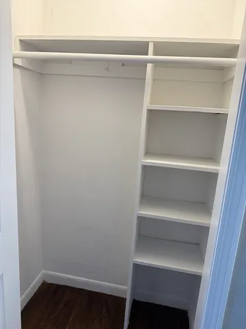 a view of an empty walk in closet